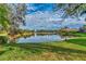 Scenic lake view in a tranquil community setting at 3195 Village Ln, Port Charlotte, FL 33953