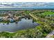 Aerial view of community with lake and golf course at 3195 Village Ln, Port Charlotte, FL 33953