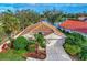 Single-story home with lake view and mature landscaping at 3195 Village Ln, Port Charlotte, FL 33953