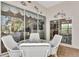 Sunroom with glass doors and a view of the backyard at 3195 Village Ln, Port Charlotte, FL 33953