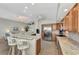 Open kitchen boasts granite counters, stainless steel appliances, and a large island at 3195 Village Ln, Port Charlotte, FL 33953
