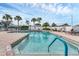 Community pool with ample lounge chairs at 1033 Yosemite Dr, Englewood, FL 34223