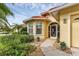 Inviting front entry with decorative door and landscaped walkway at 1033 Yosemite Dr, Englewood, FL 34223