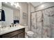 Clean bathroom with single vanity, shower/tub combo and marbled shower curtain at 1337 Sorrell Way, North Port, FL 34289