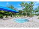 Relaxing spa with seating area under a blue shade structure at 1337 Sorrell Way, North Port, FL 34289