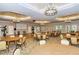 Elegant banquet hall with round tables and a projector screen at 1337 Sorrell Way, North Port, FL 34289