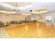 Large community room with tables, chairs, and dance floor at 1337 Sorrell Way, North Port, FL 34289