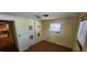 Small bedroom with hardwood floors and closet at 1700 Morning Dove Ln, Englewood, FL 34224
