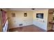 Bright living room featuring hardwood floors and large ocean-themed wall art at 1700 Morning Dove Ln, Englewood, FL 34224