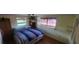 Bedroom with hardwood floors and ceiling fan at 1700 Morning Dove Ln, Englewood, FL 34224