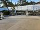 Landscaped backyard with pond and decorative statues at 1700 Morning Dove Ln, Englewood, FL 34224