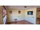 Bright living room featuring hardwood floors and large ocean-themed wall art at 1700 Morning Dove Ln, Englewood, FL 34224