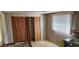 Functional laundry room with built-in shelving and window at 1700 Morning Dove Ln, Englewood, FL 34224