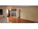 Living room with hardwood floors and large ocean-themed mural at 1700 Morning Dove Ln, Englewood, FL 34224