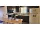 Cozy kitchen with built-in microwave and ample counter space at 1700 Morning Dove Ln, Englewood, FL 34224