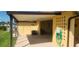 Back exterior showing covered patio area at 1700 Morning Dove Ln, Englewood, FL 34224