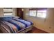 Bright bedroom with wood flooring and ample natural light at 1700 Morning Dove Ln, Englewood, FL 34224