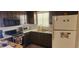 Galley kitchen with microwave, oven, and refrigerator at 1700 Morning Dove Ln, Englewood, FL 34224