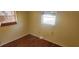 Simple bedroom with wood flooring and window at 1700 Morning Dove Ln, Englewood, FL 34224