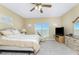 Bedroom with large window, ceiling fan and TV at 3923 Cape Haze Dr # 304, Rotonda West, FL 33947