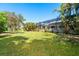 Large backyard with lush tropical landscaping at 4632 Arlington Dr, Placida, FL 33946