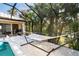 Covered patio with a hammock overlooking the pool at 4632 Arlington Dr, Placida, FL 33946