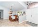 Dining room with large table and chairs, view of entry at 4632 Arlington Dr, Placida, FL 33946