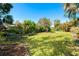 Spacious backyard with tropical plants at 4632 Arlington Dr, Placida, FL 33946