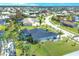 Aerial view of house and neighborhood, highlighting the property's location at 13400 Buckett Cir, Port Charlotte, FL 33981