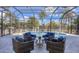 Screened patio with pool and comfortable seating at 13400 Buckett Cir, Port Charlotte, FL 33981