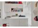 Laundry room with washer, dryer, and ample cabinet storage at 13400 Buckett Cir, Port Charlotte, FL 33981
