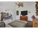 Gathering room with large TV and access to sunroom at 13400 Buckett Cir, Port Charlotte, FL 33981