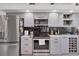 Modern kitchen with gray cabinets, marble countertops, and stainless steel appliances at 13400 Buckett Cir, Port Charlotte, FL 33981