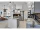Modern kitchen with gray cabinets, marble countertops, and stainless steel appliances at 13400 Buckett Cir, Port Charlotte, FL 33981