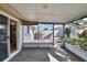Cozy screened porch overlooking a fenced backyard at 25 1St Ave, Englewood, FL 34223