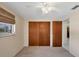Spacious bedroom with double-door closet and ceiling fan at 25 1St Ave, Englewood, FL 34223