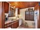 Small kitchen with wood cabinets and appliances at 25 1St Ave, Englewood, FL 34223