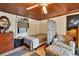 Small bedroom with wood ceiling and ample storage at 25 1St Ave, Englewood, FL 34223