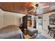 Cozy bedroom with wood ceiling, comfortable seating, and private access at 25 1St Ave, Englewood, FL 34223
