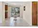Charming dining area with a round table and access to the kitchen and patio at 25 1St Ave, Englewood, FL 34223