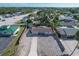 Aerial view of a single-Gathering home with a spacious yard, located in a residential neighborhood at 25 1St Ave, Englewood, FL 34223