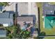 Aerial view showcasing a house and surrounding properties, providing a perspective of the neighborhood at 25 1St Ave, Englewood, FL 34223
