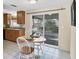 Kitchen with dining nook and sliding glass doors leading to the screened patio at 25 1St Ave, Englewood, FL 34223