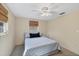 Bright bedroom with a ceiling fan and window coverings at 25 1St Ave, Englewood, FL 34223