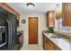 Kitchen features black appliances and granite countertops at 25 1St Ave, Englewood, FL 34223