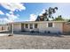 Ranch style home with a carport and well-manicured front yard at 25 1St Ave, Englewood, FL 34223