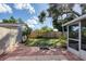 Large backyard with patio and wooden fence at 25 1St Ave, Englewood, FL 34223