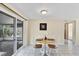 Small dining area with a table and chairs near sliding doors at 25 1St Ave, Englewood, FL 34223