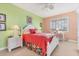 Charming bedroom with coral bedding and white wooden furniture at 13413 Gasparilla Rd # D205, Placida, FL 33946