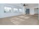 Spacious living room featuring neutral carpeting at 20 Annapolis Ln, Rotonda West, FL 33947